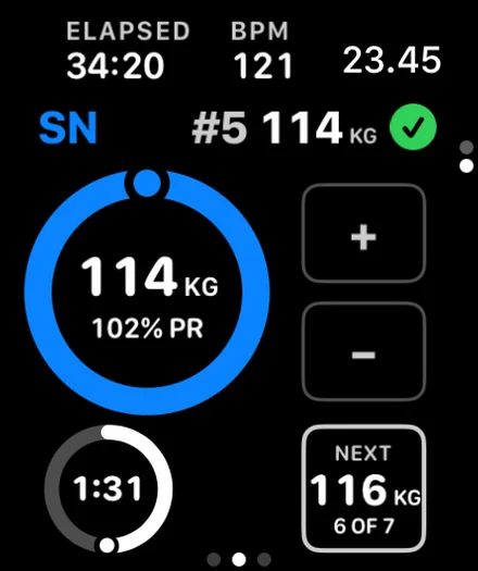 A Nosto session on an Apple Watch: a dial reading 114 kg at 102 percent of record with a tick for the fifth lift, a live heart rate of 121, a rest ring, and the next planned step of 116 kg.